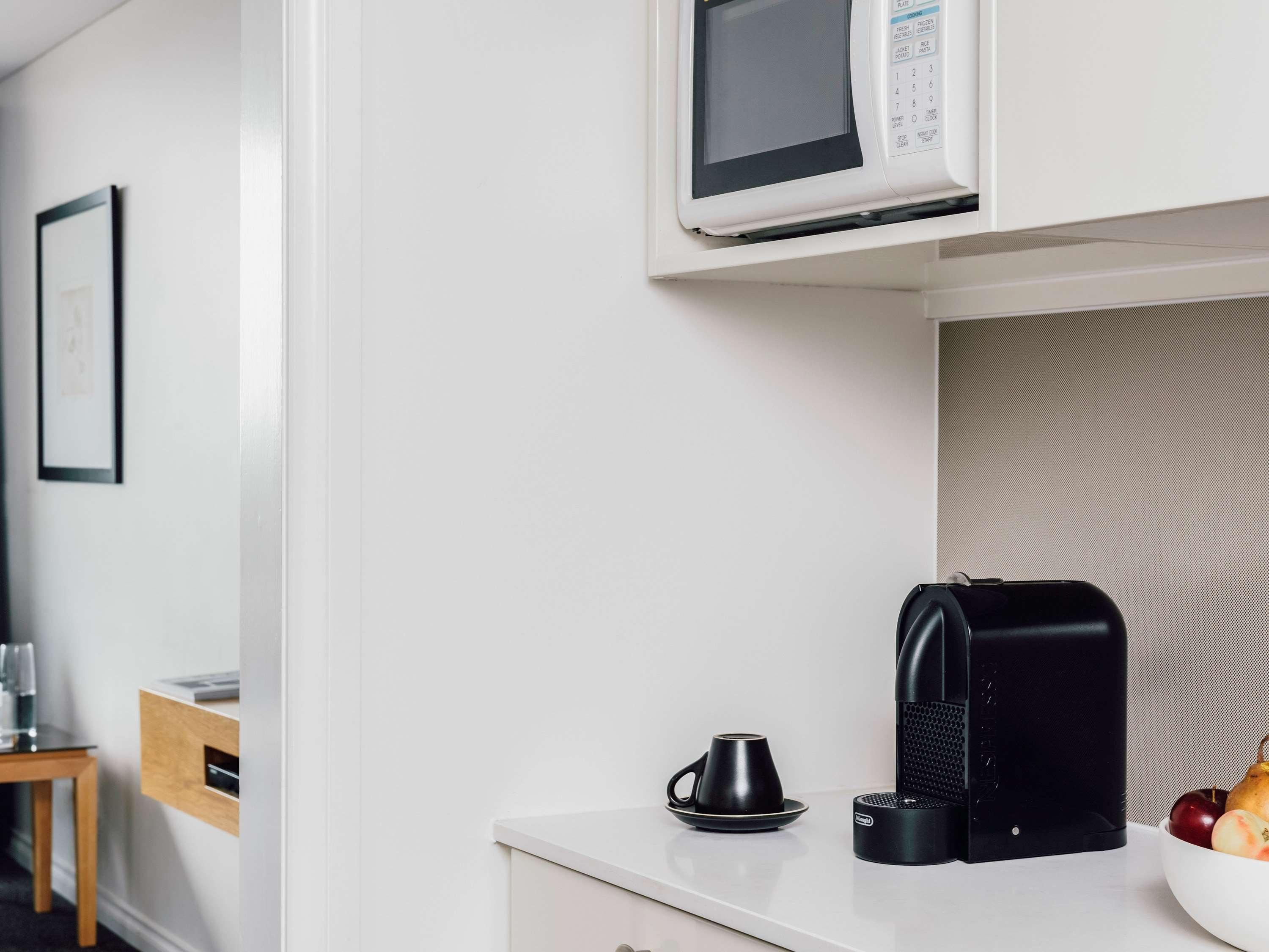 Quay West Suites Melbourne Exterior photo A Nespresso coffee machine in a hotel