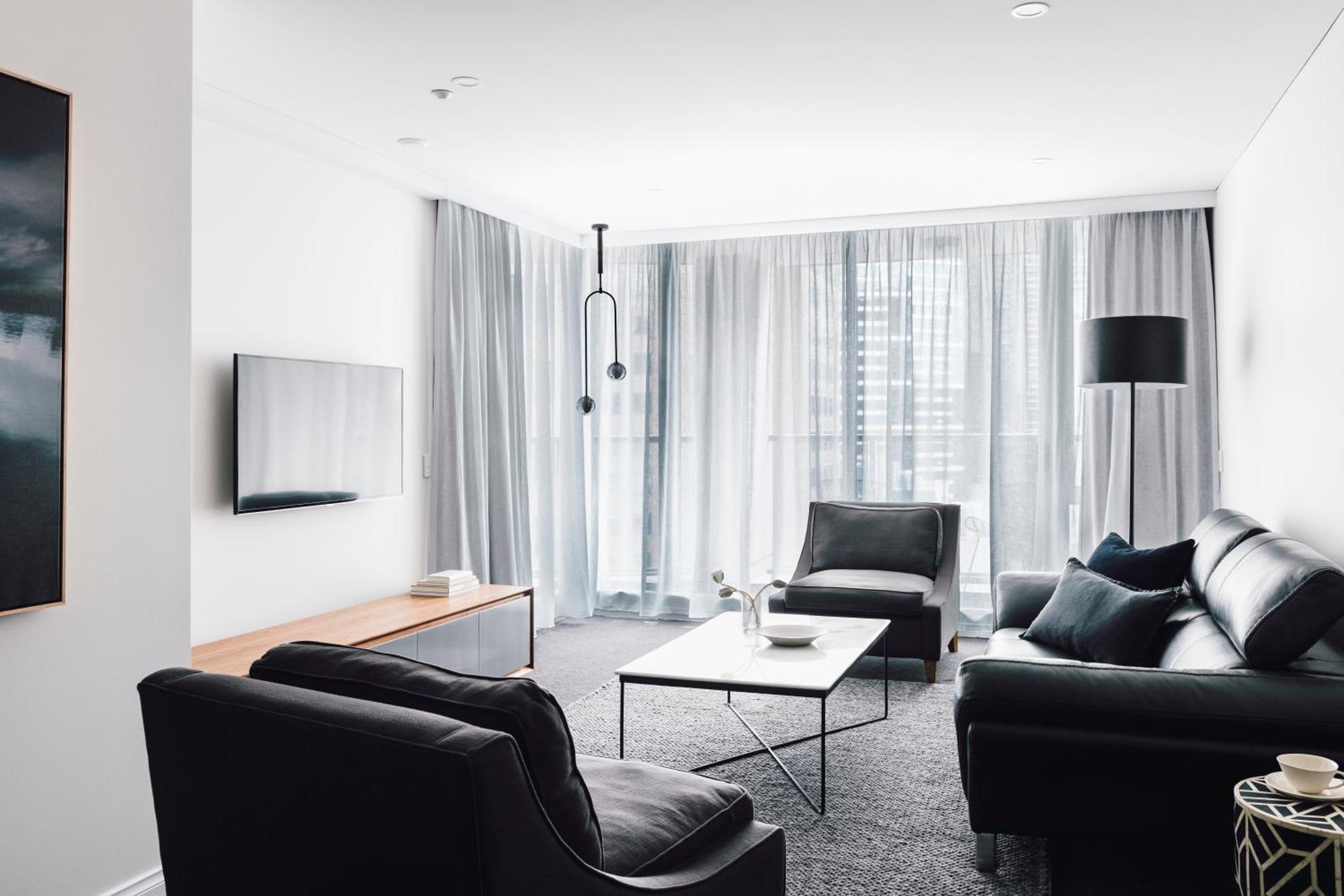 Quay West Suites Melbourne Exterior photo A living room in a modern apartment