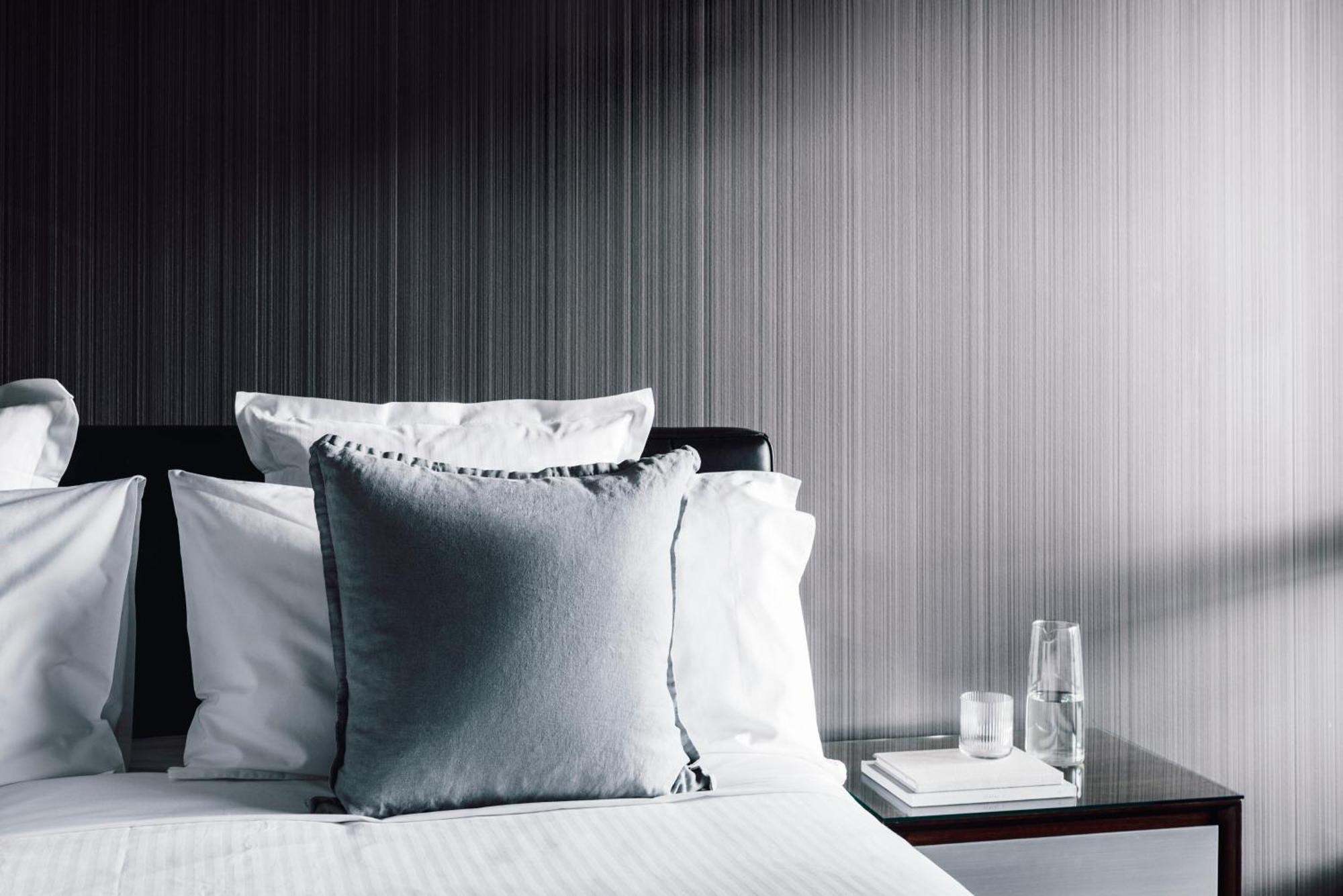 Quay West Suites Melbourne Exterior photo A bed with pillows